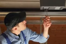 Man fixing a garage door opener