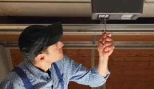 Man fixing a garage door opener